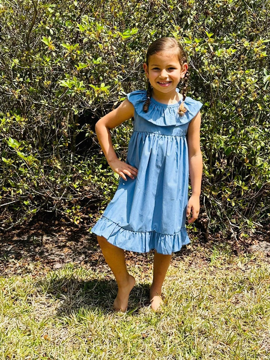 The ALICIA sleeveless ruffle dress evokes the look of classic summer floral fashion with its solid colors and chic ruffles. Cut in an a-line shape with a semi-open back, it is available in periwinkle, olive, and mauve. The O-neck and sleeveless styling make it the perfect choice for a warm day.