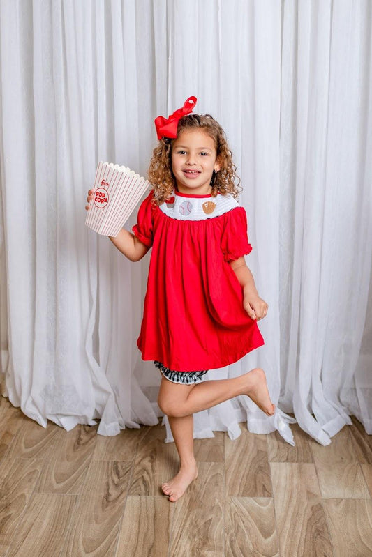 RUTH - Introducing the RUTH Baseball Matching Girls Set, the perfect way to dress up for the game. Featuring beautiful baseball embroidery, a smocked a-line top with puff sleeves, and classic black, white, and red colors, this set is guaranteed to make your little girl feel like a home-run champion.o