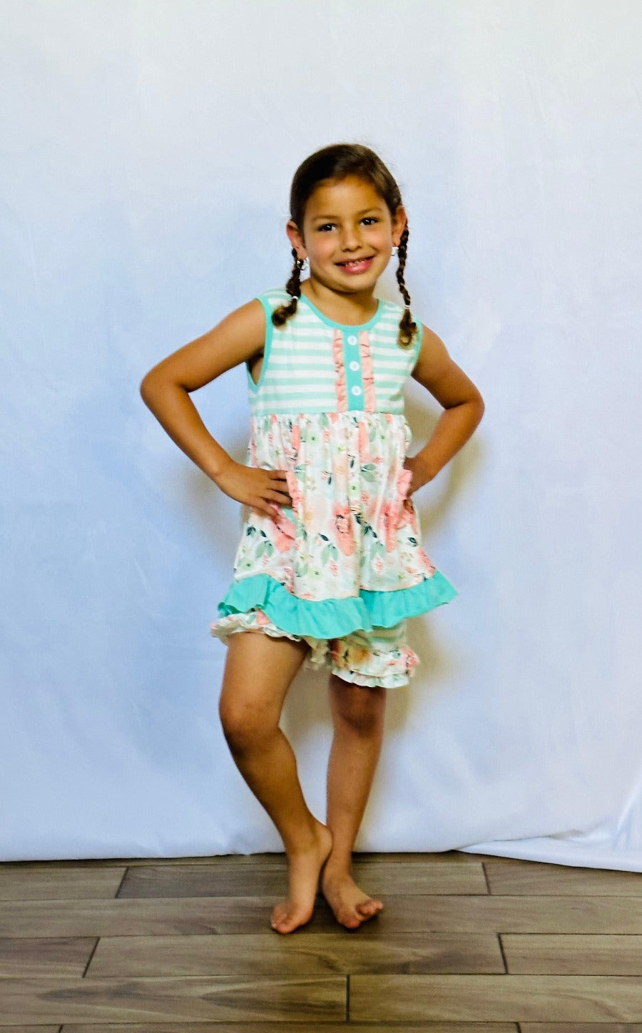 SOFIA - Girls 2 Piece Floral Set - This sweet 2-piece set from SOFIA is perfect for any occasion. It features a mix of stripes, floral, and ruffles in shades of teal, peach, white, and pink. This sleeveless short set is sure to put a smile on your little girl's face.